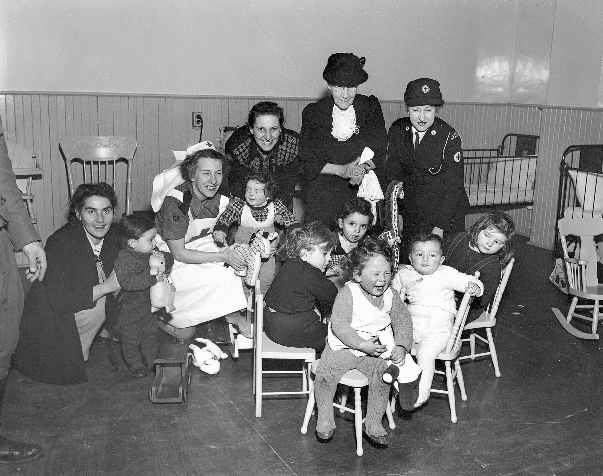 Immigrant Children with Red Cross Port Workers, Pier 21, Halifax, Nova Scotia, Canada, 1948